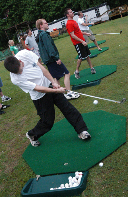 Senior Steve Yzaguirre attempts to hit a bullseye at the Dory Brothers driving range during the Watters Amazing Race.