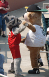 Buster plays with fellow mascot Ribbie at Union Night at the West Tennessee Diamond Jaxx ballpark. - Photo by Justin Veneman