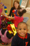 GO Memphis team member Crystal Skelton plays with children in the nursery at the Salvation Army. - Photo by Lindsay Stavish
