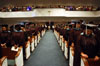 Graduates bow in prayer during the Aug. 7 service at West Jackson Baptist Church.
 - Photo by Morris Abernathy