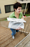 Gwyn Bell, computing services secretary, helps new students move in to the dorms. - Photo by Kristen Hiller