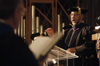 Dr. Richard Joiner, chair of the music department, leads the fall convocation audience in the university hymn <i>Joyful, Joyful We Adore Thee</i>. - Photo by Kristen Nicole Sayres