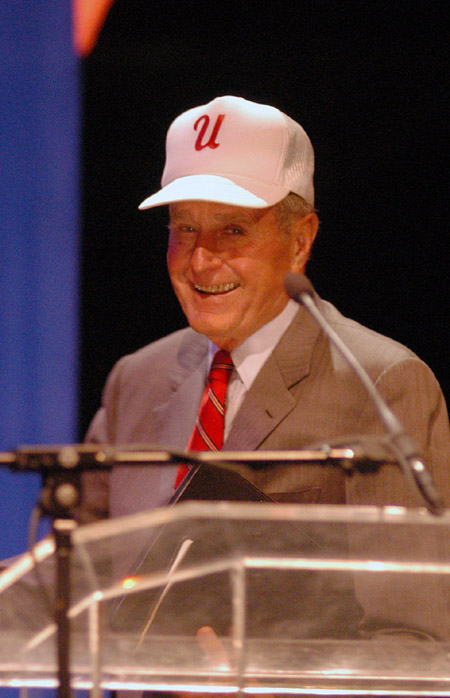 Former U.S. President George H.W. Bush dons a Union baseball cap after his speech at the Scholarship Banquet. 