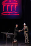 Union President David S. Dockery presents former President Bush with gifts from the university, including a Union baseball cap. - Photo by Jim Veneman