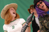 Freshman Abigail Carpenter and junior Jennifer Hanes rock out as they make a music video during Fall Fest '04.  - Photo by Jonathan Blair