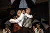 Freshman Kate Rawls and sophomore Rachel Winford creatively used umbrellas in their large group routine for Chi Omega during All-Sing 2004. - Photo by Kathleen Murray