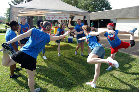 Members of SAC stretch before helping freshmen move in during New Student Orientation.