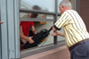 A couple of parents help their student move into a dorm room during Freshmen Move-In. - Photo by Kristen Nicole Sayres