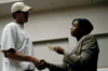 Director of career services Jacqueline Taylor presens Eric Vanderburg with a gift certificate during the closing session of the fourth annual Career University. - Photo by Kathleen Murray