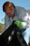 Coordinator of special events Phyllis Davenport picks up trash around the premises at Birth Choice. - Photo by Amanda Herron