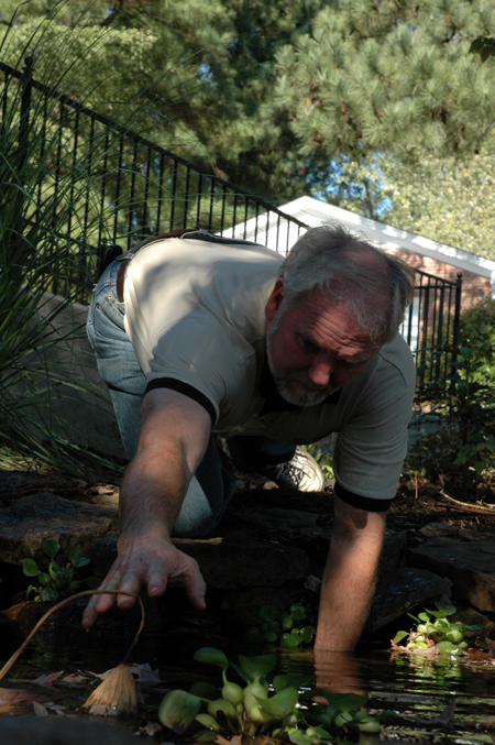 Brent Lambert, Birth Choice's director, worked along with the Union volunteers as he pulled weeds in a pond during Day of Remembrance.