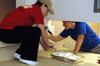 Seniors Anna Curlee & Amy McCutcheon paint at The Dream Center of Jackson during Day of Remembrance. - Photo by Amanda Herron