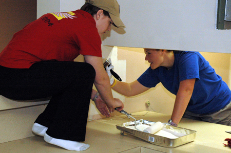 Seniors Anna Curlee & Amy McCutcheon paint at The Dream Center of Jackson during Day of Remembrance.