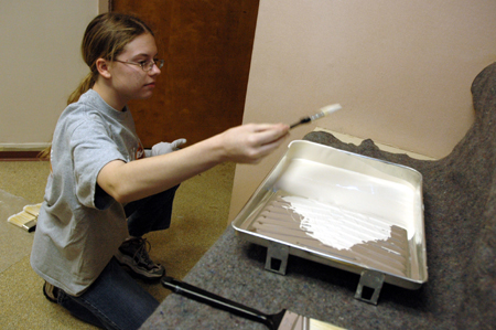Sarah Smith paints at The Dream Center of Jackson during Day of Remembrance.