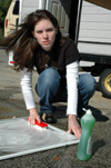 Bess Perrier washes screens at Birth Choice during Day of Remembrance. - Photo by Amanda Herron