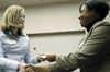 Jacqueline Taylor, career services director, presents Lana Cosby with a door prize during the fourth annual Career University. - Photo by Kathleen Murray