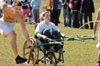 Junior Amanda Raley, psychology major, holds on tight as sophomore Blake Pennington, management major loses control of the LXA chariot. Although nobody was seriously hurt, questions remain concerning future chariot races.
 - Photo by Kristen Hiller
