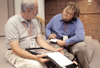 Bill Bangham (left), photo editor at the International Mission Board of the Southern Baptist
Convention, critiques photos by senior Jonathan Blair, digital media studies major, during the BP journalism conference. - Photo by Lindsay Stavish