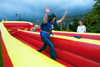 Christen Tucker, sophomore Christian Studies major, has fun with the bungee cord at Fall Fest 2002. - Photo by Kristen Hiller