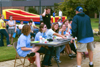 Mark VanderHaar confers with the judges about the Battle of the Bands at Fall Fest 2002. - Photo by Kristen Hiller
