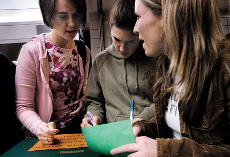 Freshman Erin Brassart (left), Laura Byrd (center) and Lauren Goley (right) vote for SGA Executive officers for the 2005-2006 school year, before entering the cafeteria for lunch.
