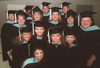 Graduates from the Master of Education, cohort 6, pose briefly before Union's August graduation ceremony. - Photo by Jim Veneman