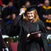 An excited Laura Bush, marketing graduate from Jackson, moved her tassle after receiving her diploma at fall graduation. - Photo by Morris Abernathy