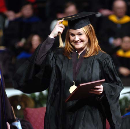 An excited Laura Bush, marketing graduate from Jackson, moved her tassle after receiving her diploma at fall graduation.