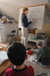 <i>Salazar Family C&C Profile</i> - Keri leads the twins in an English lesson as oldest son Caleb studies on his own. - Photo by Kristen Nicole Sayres