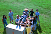 Brad Spencer takes the plunge into the arms of his FOCUS group during New Student Orientation 2002. - Photo by Justin Veneman