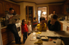<i>Salazar Family C&C Profile</i> - The Salazar family gathers to catch up on the news before breakfast. - Photo by Kristen Nicole Sayres