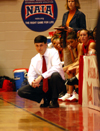 Head coach Mark Campbell watches from the sideline as his Lady Bulldogs perfom in the opening round of the 2005 NAIA National Tournament. - Photo by Morris Abernathy