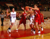 Stephanie Clark and a Lubbock Christian player battle for a loose rebound in Union 77-55 opening round win in the 2005 NAIA National Tournament. - Photo by Morris Abernathy