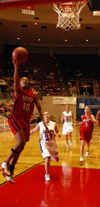 Ena Daniels (10) finishes a fast break with a layup during Union's 77-55 win in the first round of the 2005 NAIA National Tournament. - Photo by Morris Abernathy