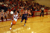 Senior guard Monica Elliot (24) drives past a Lyon College defender in a win during Homecoming Week. - Photo by Morris Abernathy