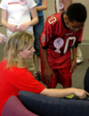 Senior Stacey Chandler interacts with a junior high school student during a Students in Free Enterprise (SIFE) project. - Photo by Lauren Crane