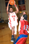 Marcus Cooper (5) drives past a Lyon College defender in Union's TranSouth Conference Tournament Championship game win. - Photo by Jonathan Blair
