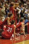 Union Lady Bulldogs, Merideth Richardson (31), Molly York (sitting), Tiffany Fisher (standing), and Peggy McCain (21), watch intently during the final seconds of regulation during Union's second round game in the NAIA National Tournament.  Union defeated North Georgia in this game 83-75 in overtime. - Photo by Kristen Nicole Sayres
