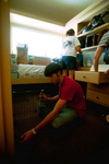 Freshman Joel Polk begins to settle in to his new home away from home during Freshman Move-In. - Photo by Justin Veneman