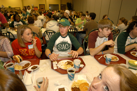 Freshmen Ben Rivers shares with some friends and prospective students during the Spring Thing weekend.