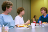 Freshman Nursing major Lauren Bray with her grandmother Virginia Wimberley and mother Lesa Bray sharing a meal together after moving in during New Student Orientation 2002. - Photo by Amanda Smith