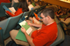 An incoming freshman looks over a collection of registration forms during the Spring Thing weekend. - Photo by Morris Abernathy