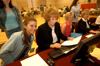Provost administrative assistant Linda Baker helps an eager incoming freshman register for classes. - Photo by Morris Abernathy