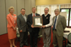 Michael Hayes ('74 - center) was recently inducted into the Hammons Society of Fellows, a program that promotes professionals and their efforts to advance the cause of Christ in the area of science.  He is pictured here at his induction with Barbara McMillin, dean of the college of arts & sciences; Charles Baldwin, OP and Evalyn Hammons university professor of pre-medical studies; David S. Dockery, president; and James Huggins, director of the Hammons Center for Scientific Studies. - Photo by Jim Veneman