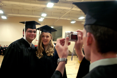 Broadcasting graduate Jonathan Yorkowitz and public relations graduate Jenny Eastman pose for a photo prior to the graduation ceremony.