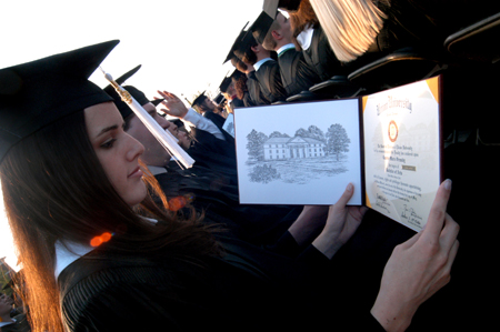 Digital media studies graduate Lauren Ormsby examines the layout of her degree at spring graduation.