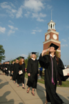 Graduates file onto the Great Lawn for the spring graduation ceremony. - Photo by Jim Veneman