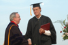 President David S. Dockery congratulates Bobby Morris on completing his degree. - Photo by Jim Veneman