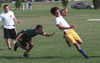 Freshman Joel Polk, narrowly escapes a tackle in the intramural flag football game by sophomore Logan Creasy, music major, while junior Chad Davis, Christian studies major, looks on. - Photo by Justin Veneman