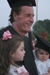 Bobby Morris celebrates his accomplishment with two of his grandchildren. - Photo by Kyle Kurlick